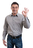 Happy young man gesturing OK sign