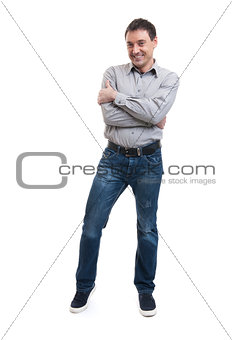Happy smiling young man standing full length