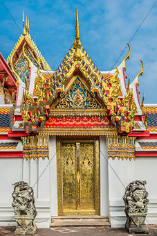 golden door dragon statues Wat Pho temple bangkok Thailand