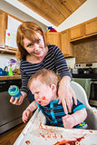 Woman Feeds Her Gumpy Baby