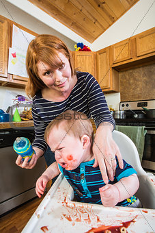 Woman Feeds Her Gumpy Baby