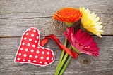 Colorful gerbera flowers and Valentine's day heart