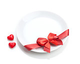 Valentine's Day heart shaped candy and plate with red bow