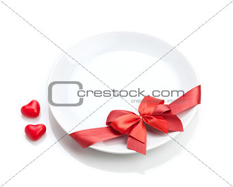 Valentine's Day heart shaped candy and plate with red bow