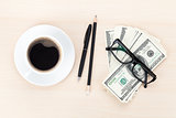 Money cash, glasses, pen and coffee cup 