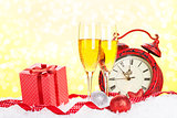 Champagne, gift box and christmas clock