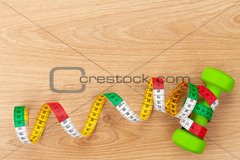 Dumbells and tape measure. Fitness and health