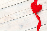 Valentines day background with toy heart and ribbon