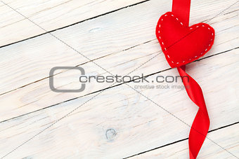 Valentines day background with toy heart and ribbon