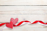 Valentines day background with toy hearts and ribbons