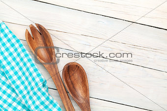 Kitchen utensil over white wooden table background
