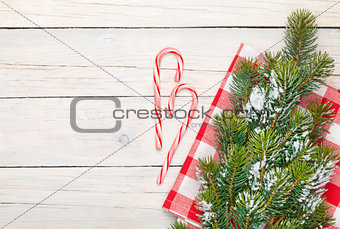 Christmas background with candy cane and snow fir tree