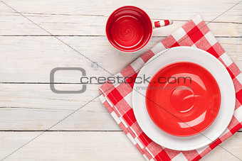 Empty plate, cup and towel