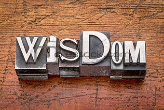 wisdom word in metal type 