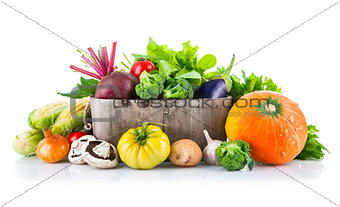 Fresh vegetables in wooden bucket with leaf lettuce