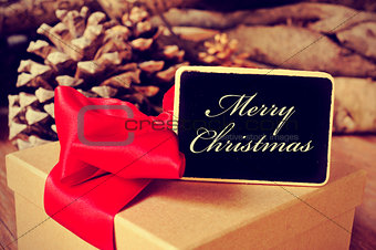 gift and signboard with the text merry christmas