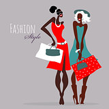 Fashion girls. Women with shopping bags.