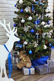 christmas decorated tree with deer and presents