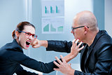 business woman fighting business man