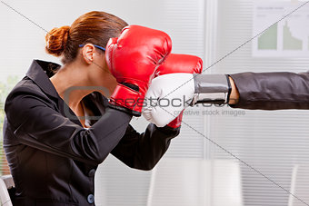 boxing business woman defending from a punch