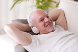 self-confident man relaxing on a sofa