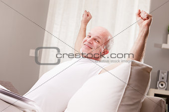 man stretching and going asleep
