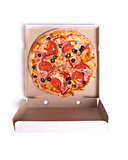 Delicious pizza with ham and tomatoes in box 