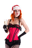 Beautiful cabaret girl in Santa Claus hat holding glass of champ