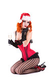 Sensual burlesque girl in Santa Claus hat holding glass of champ