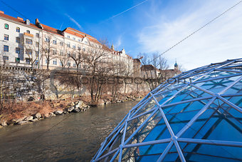 Graz city seen from Island on Mur river connected by a modern st