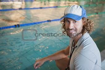 Portrait of a swimming coach by the pool
