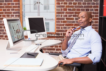 Businessman with computer at office desk