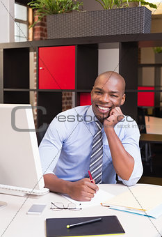 Businessman with computer at office desk
