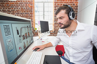 Concentrated photo editor using computer in office