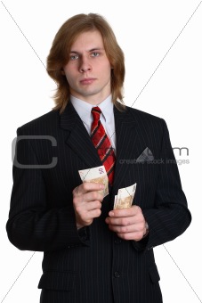 a businessman in a suit considering money