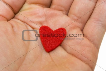 Red heart on hand