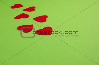 paper hearts on green