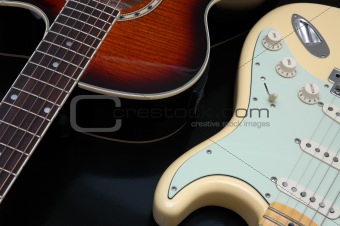 Closeup of 2 guitars
