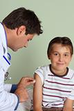 Doctor injecting child vaccine