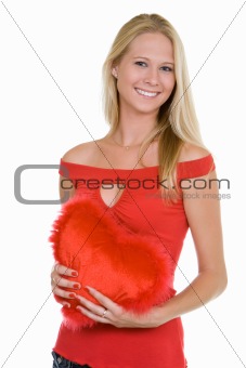 Happy young woman  holding a heart