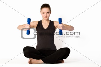 Young girl is concentrating on weights