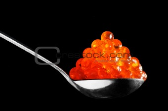spoon with red caviar 