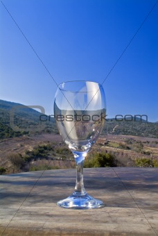 empty wine glass against landscape