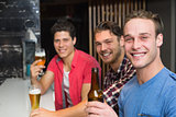 Young men drinking beer together