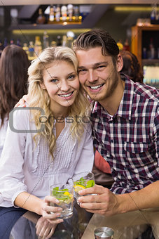Young couple having a drink together