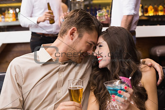 Happy couple having a drink together