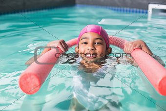 Cute kid swimming in the pool