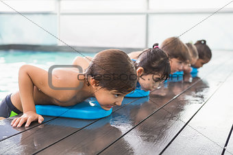 Cute swimming class in the pool