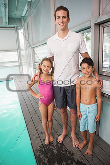 Swimming coach with his students
