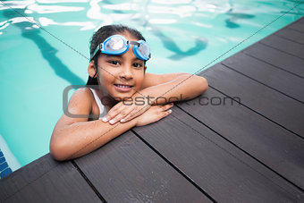 Cute little girl smiling in the pool